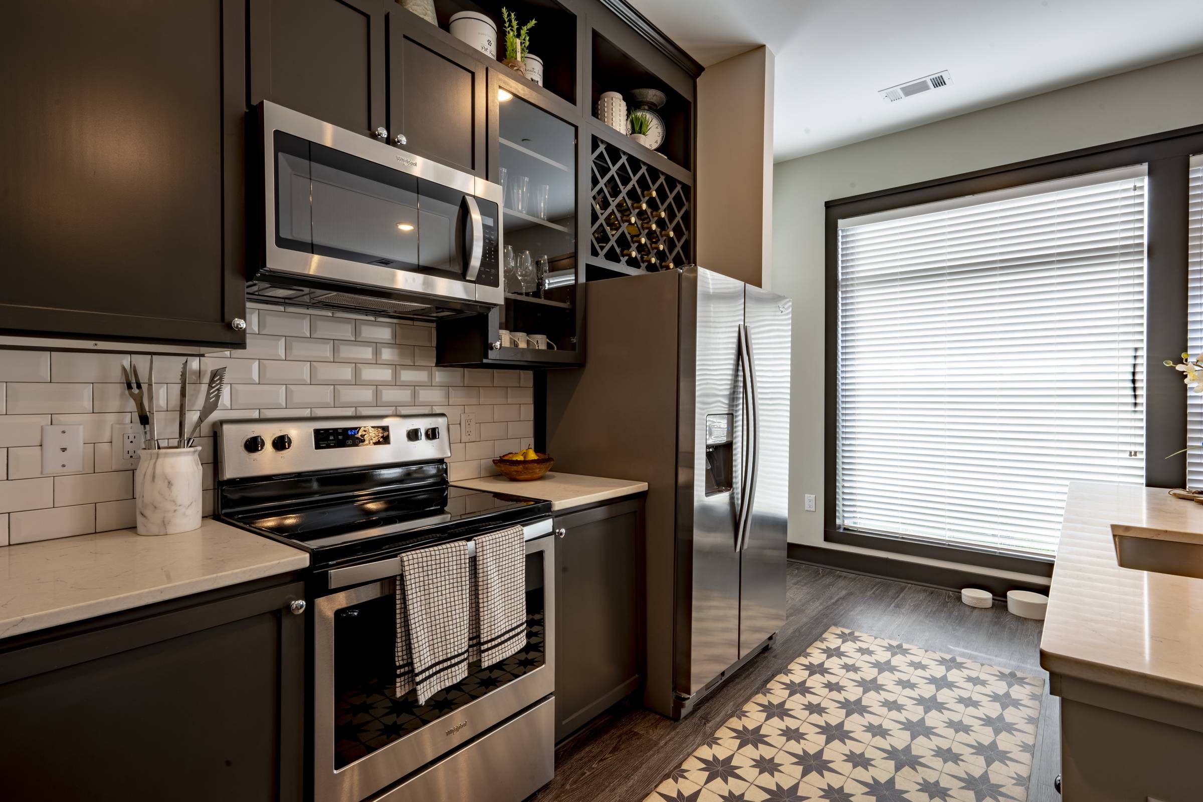 Residences at Capitol View luxury apartment kitchen with stainless steel appliances