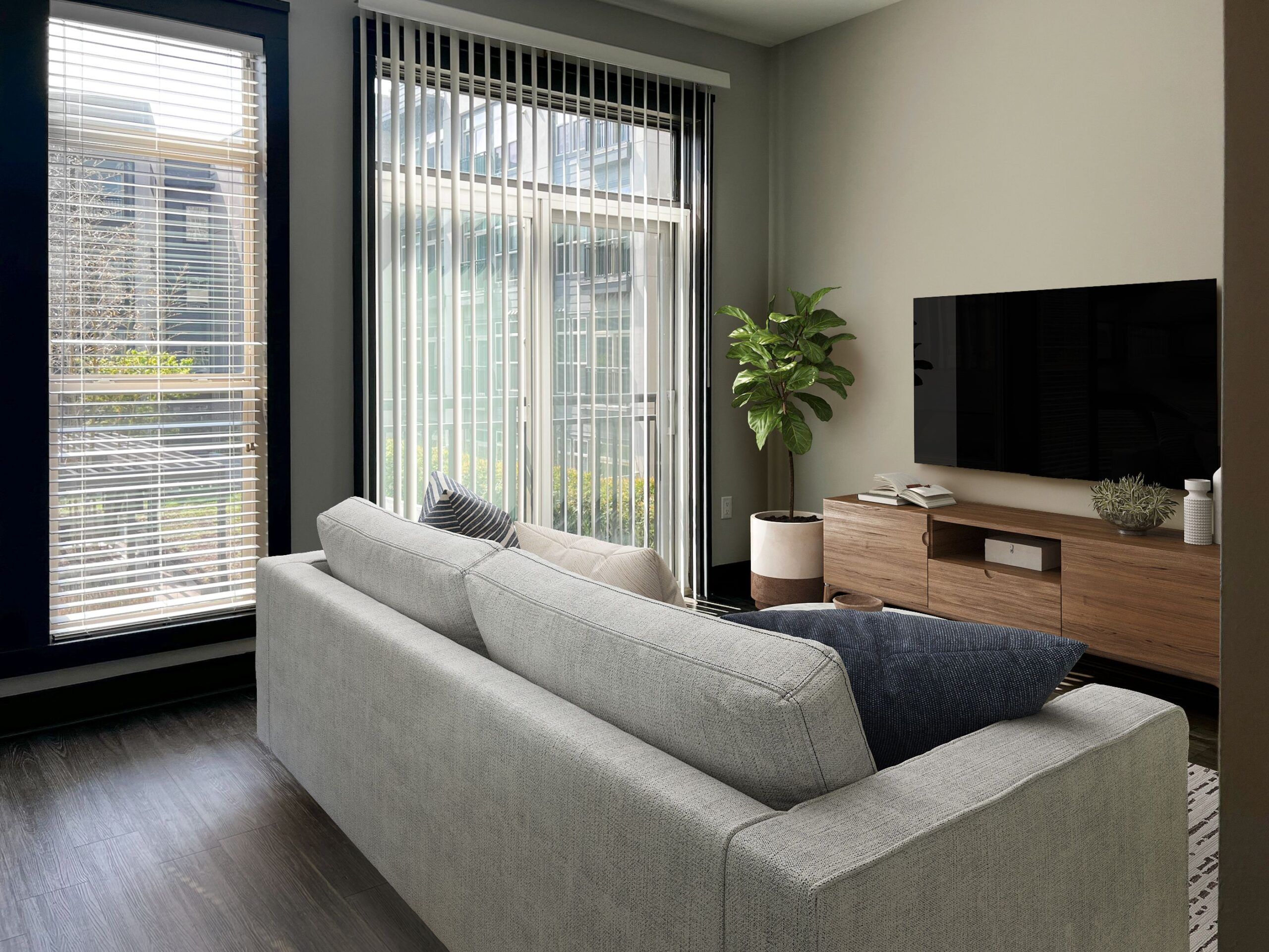 Residences at Capitol View luxury apartment interior living room with grey couch and tv