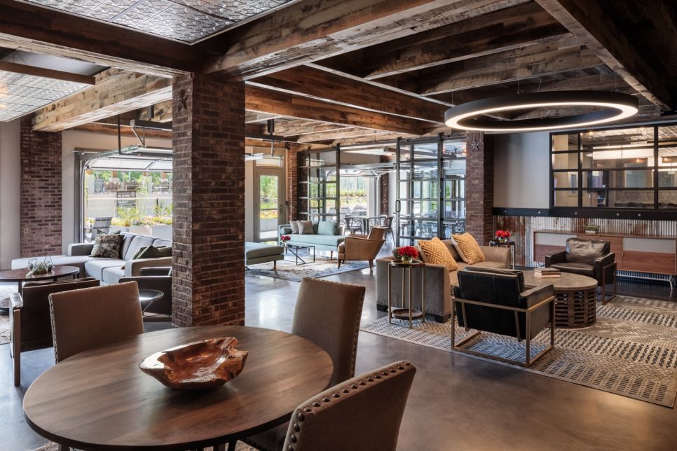 Residences at capitol view resort style pool amenity with ample seating around the pool and a view of the city in the background