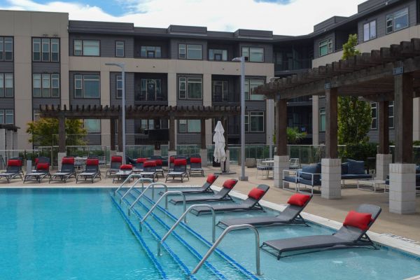 Residences at Capitol View luxury pool amenity with beach style seating