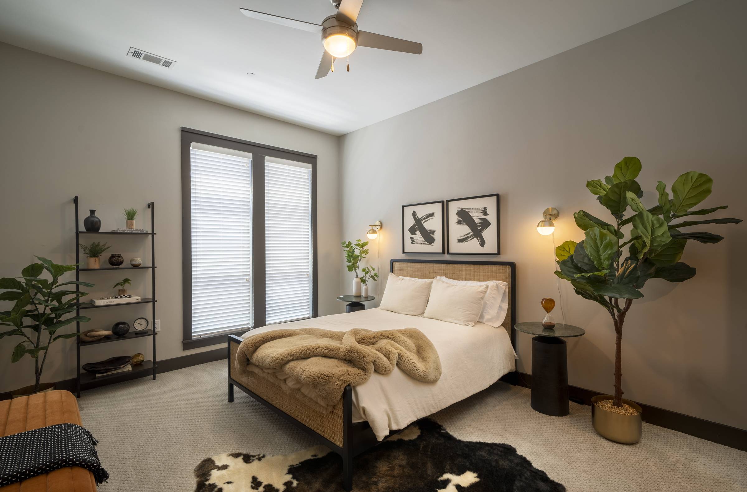 Residences at Capitol View luxury apartment bedroom with modern furnishings and large windows