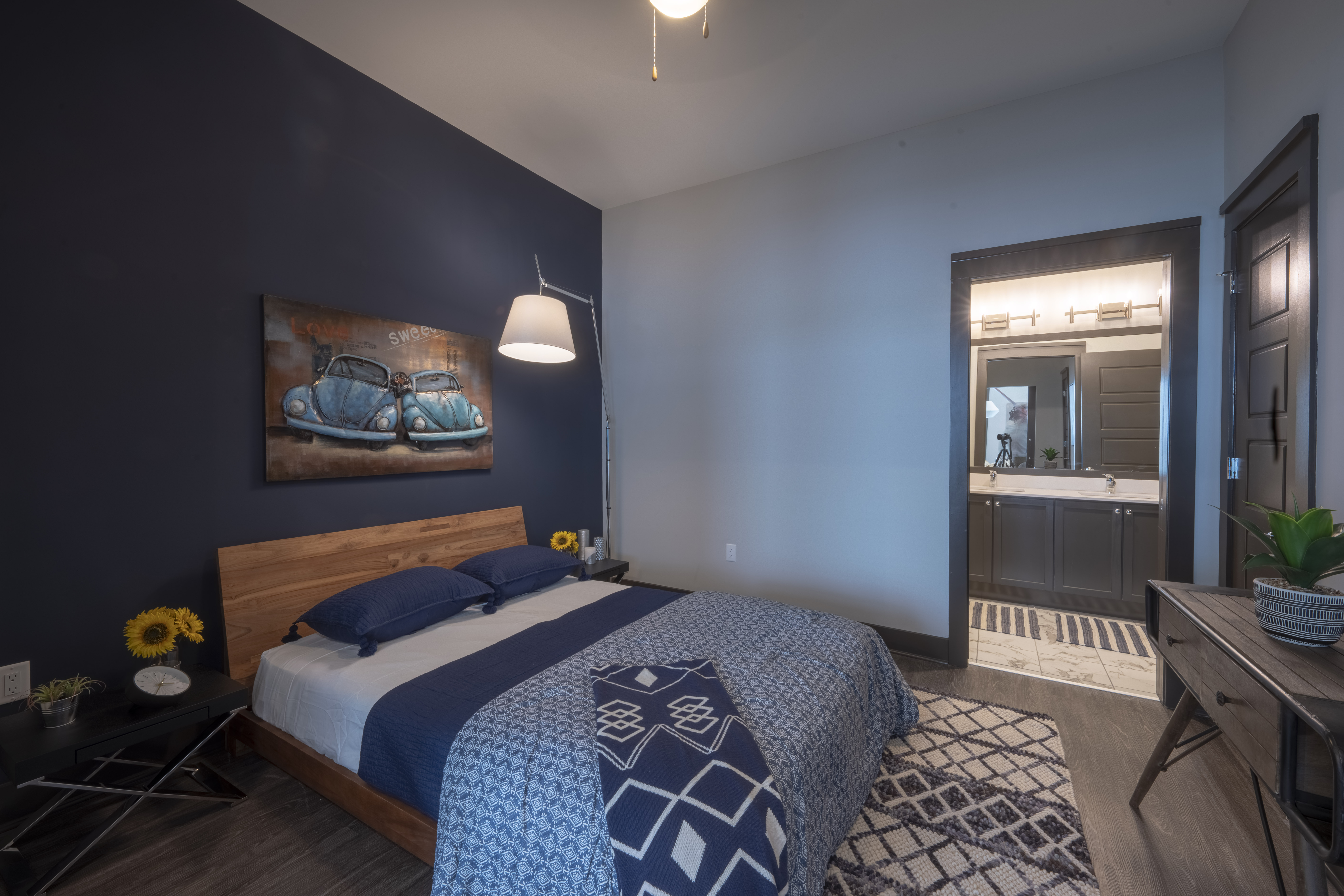 Residences at Capitol View luxury apartment interior living room with grey couch and tv