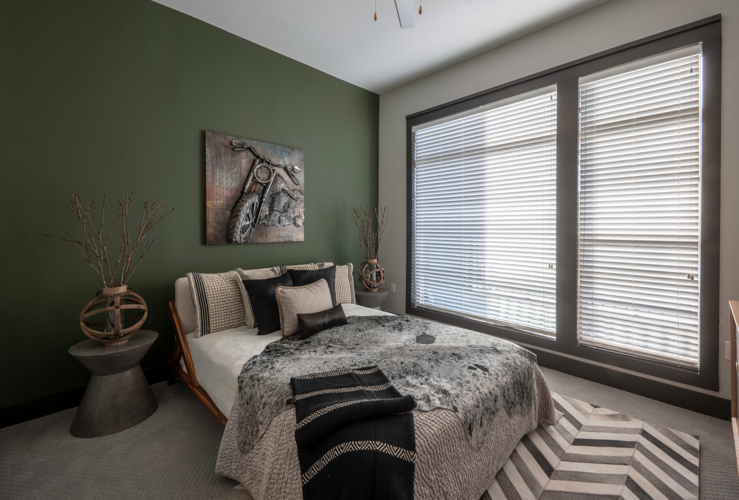Residences at Capitol View luxury apartment interior with grey couch and wooden coffee table