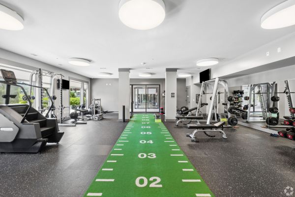 Residences at Capitol View modern gym with free weights and weight equipment